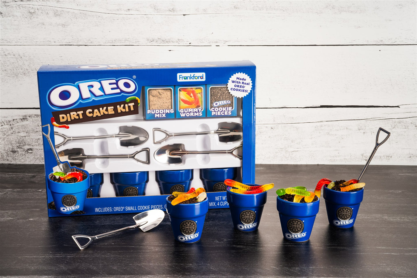 OREO Dirt Cake Kit with packaging, buckets, and tools on a wooden surface.