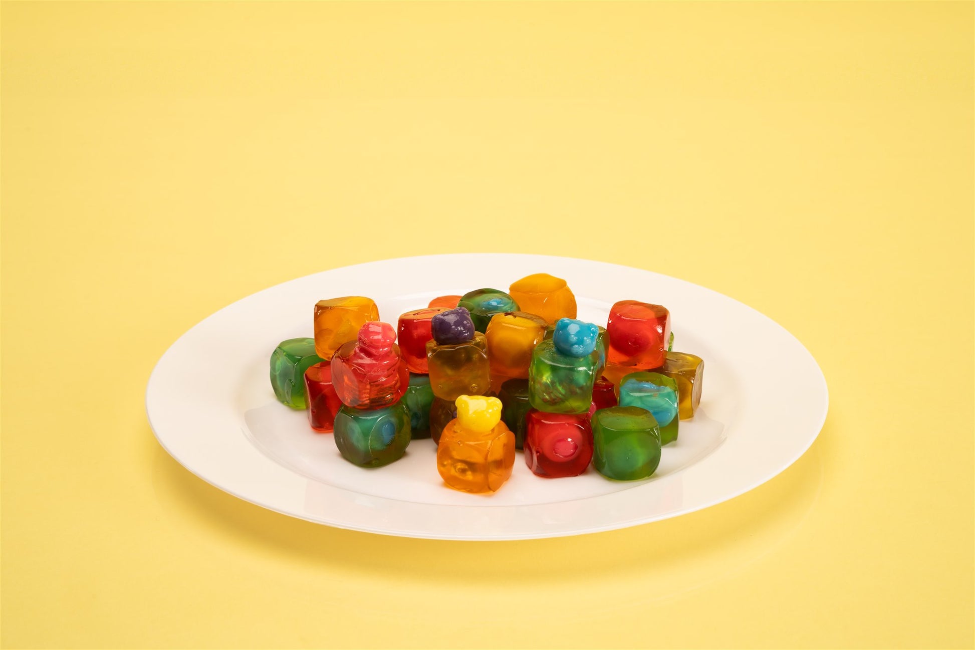 white plate filled with gummy candy animal cubes