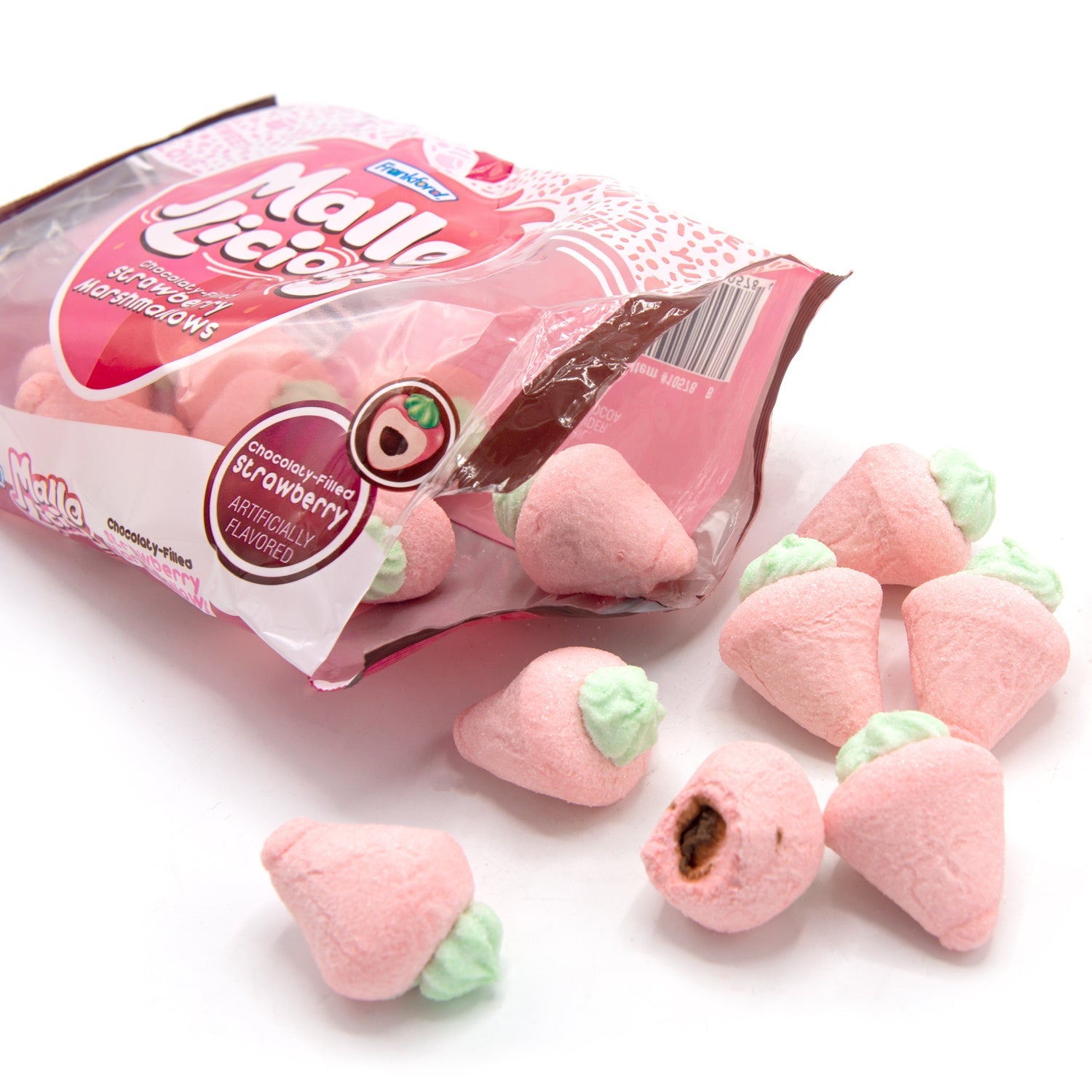 Opened pink bag with pink strawberry shaped marshmallows. one broken marshmallow with chocolate filling