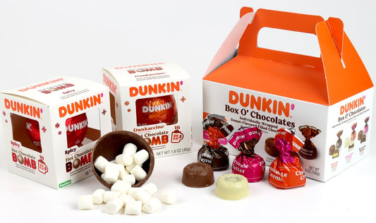 Two Dunkin' Hot Chocolate BOMBs next to the Dunkin' Box O' Choclates