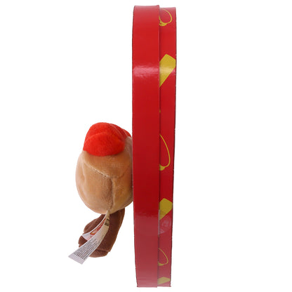 side view of yellow heart shaped box with red border and a hot dog plush on the front
