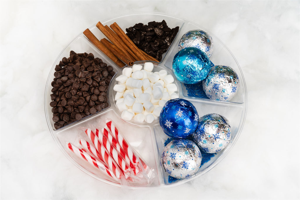 Serving tray with Oreo hot chocolate bombs and hot chocolate add-ons 