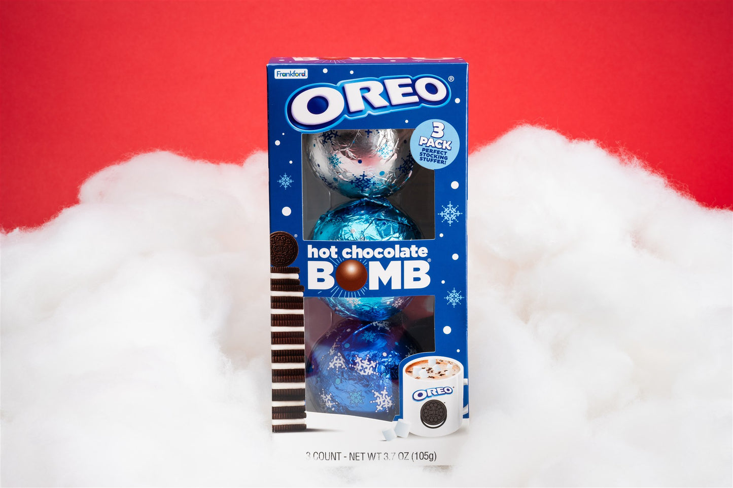 Oreo hot chocolate bomb 3 pack infront of red background and clouds 
