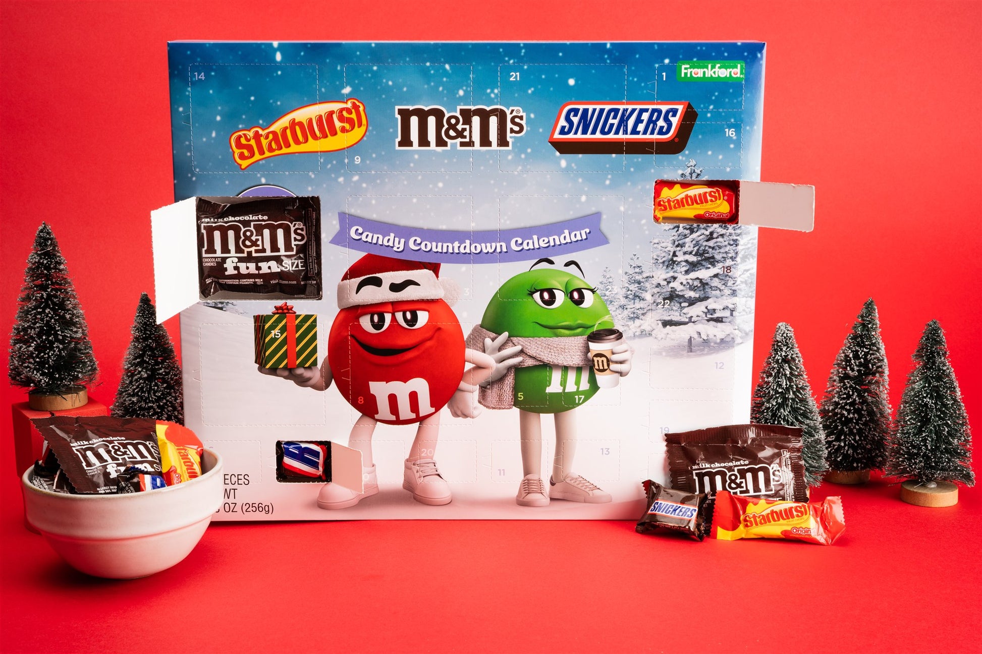 Candy Countdown Calendar with M&M's, Snickers, and Starburst on a red background