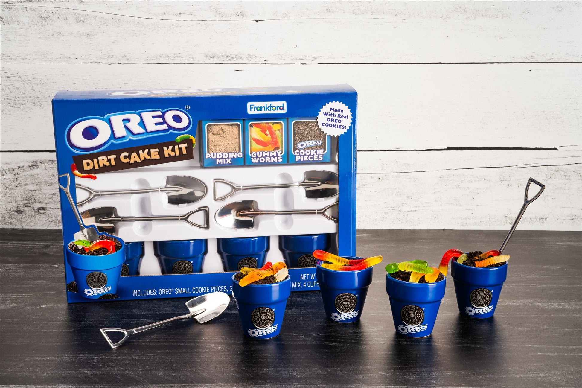 OREO Dirt Cake Kit with packaging, buckets, and tools on a wooden surface.