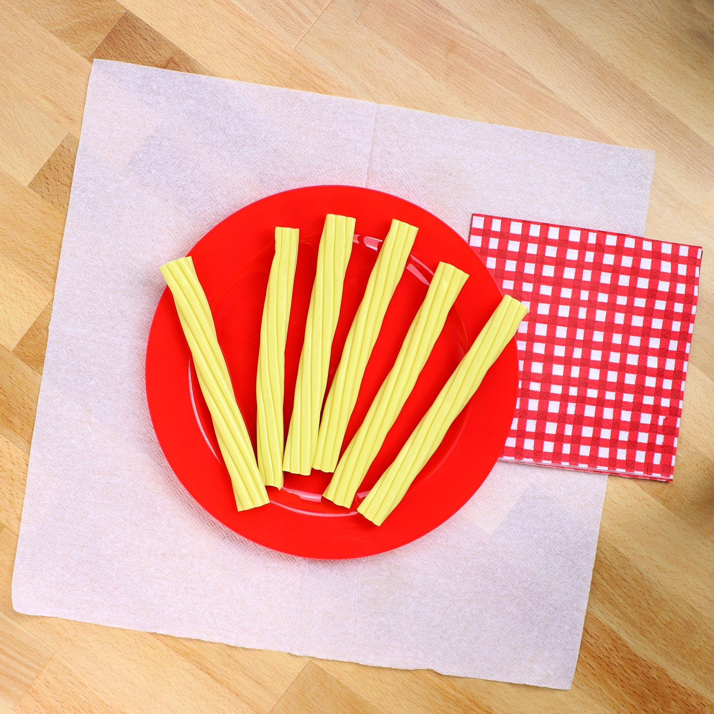 Gummy string cheese candy on a plate on dinner table 