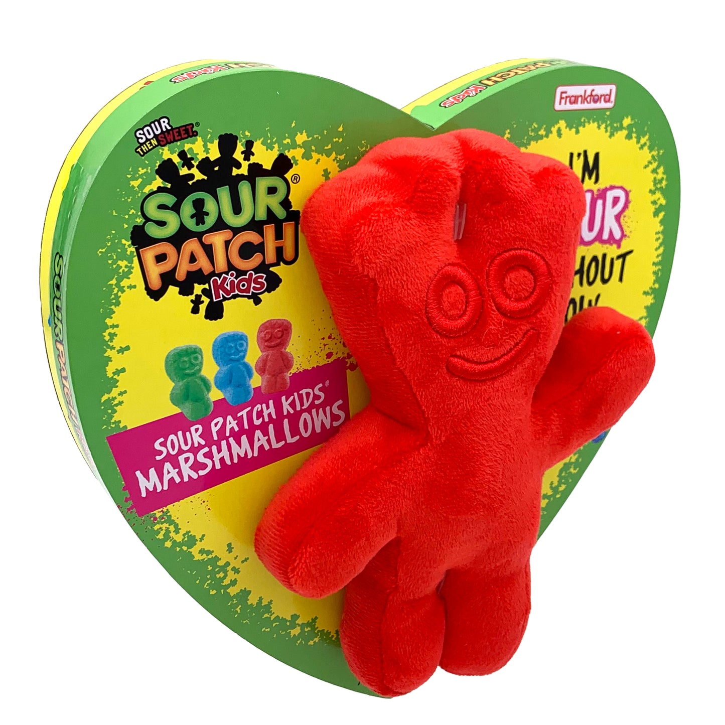 yellow heart shaped box with a green border and a red sour patch plush toy on the front