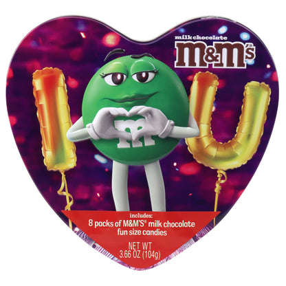 heart shaped tin with a green M&M character on the front with balloons that speel out I <3 U