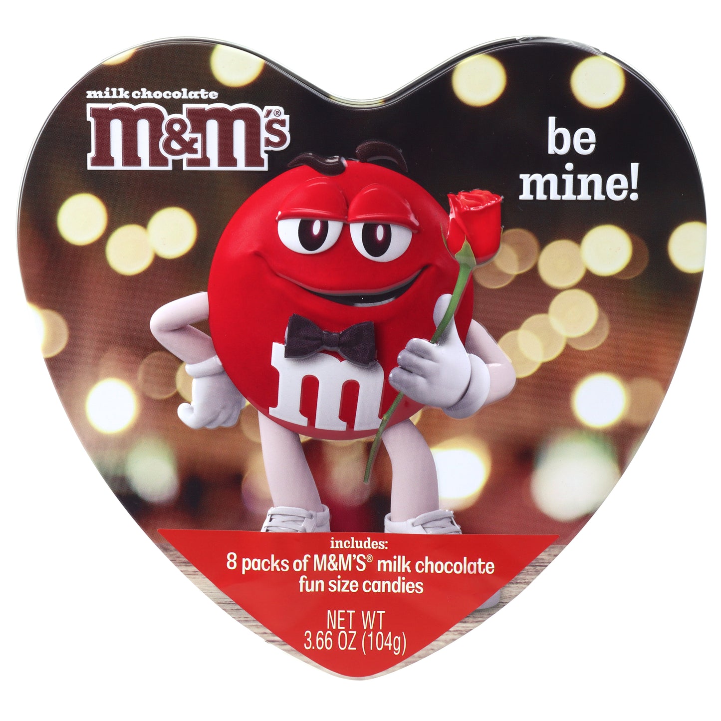 heart shaped tin with yellow circles in the background with a red M&M character holding a rose and the words be mine