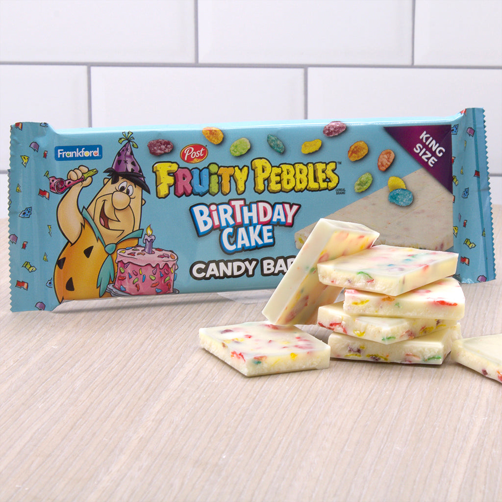 blue fruity pebbles candy bar with white candy bar broken into pieces with multi colored fruity pebbles cereal