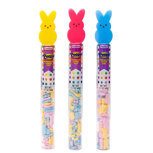 one yellow, one pink, and one blue bunny tube topper filled with multi colored hard candies