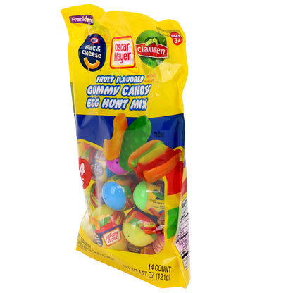 yellow bag filled with plastic eggs filled with mac and cheese, pickle, and hot dog gummies