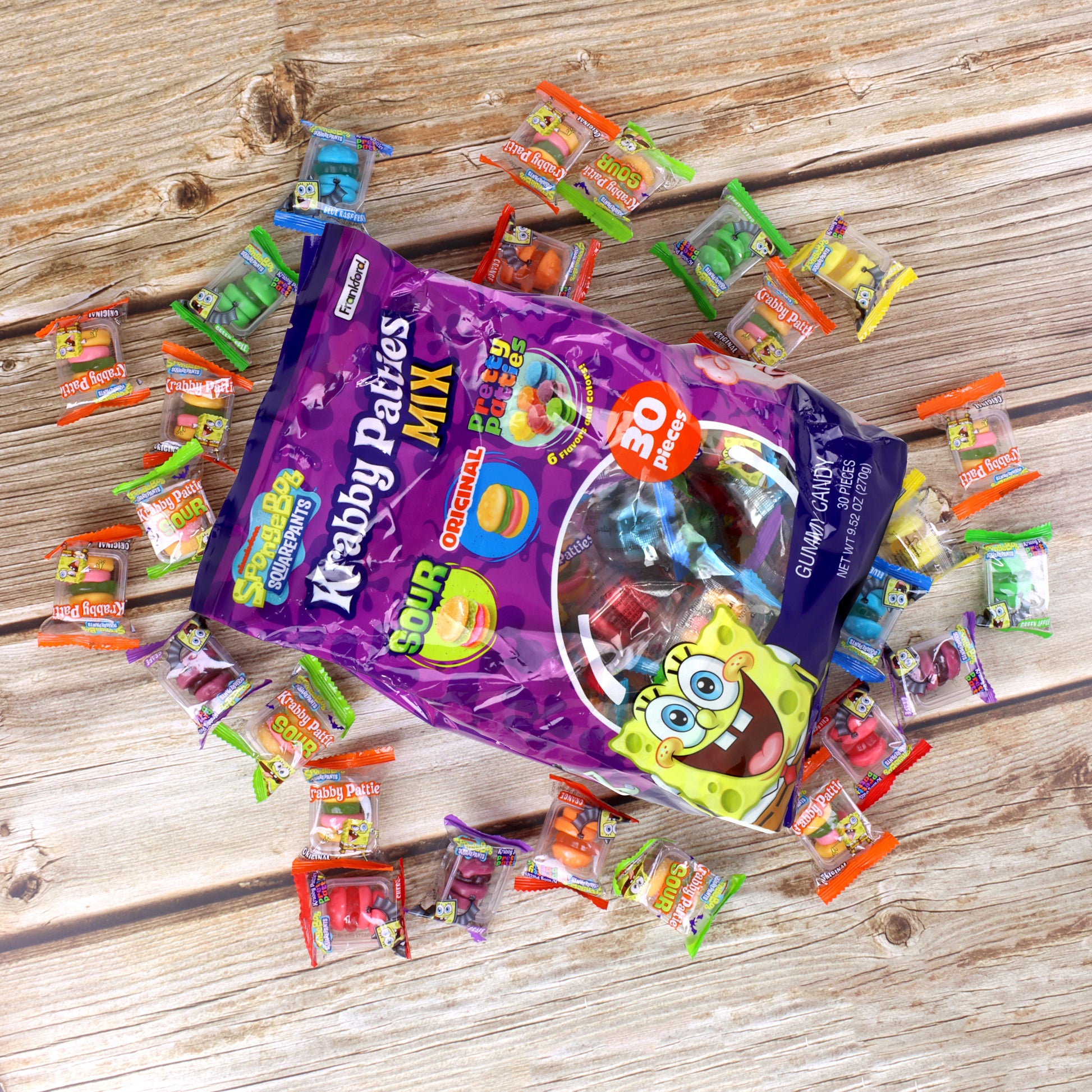 Krabby Patties Mix bag with scattered individual packets on a wooden surface