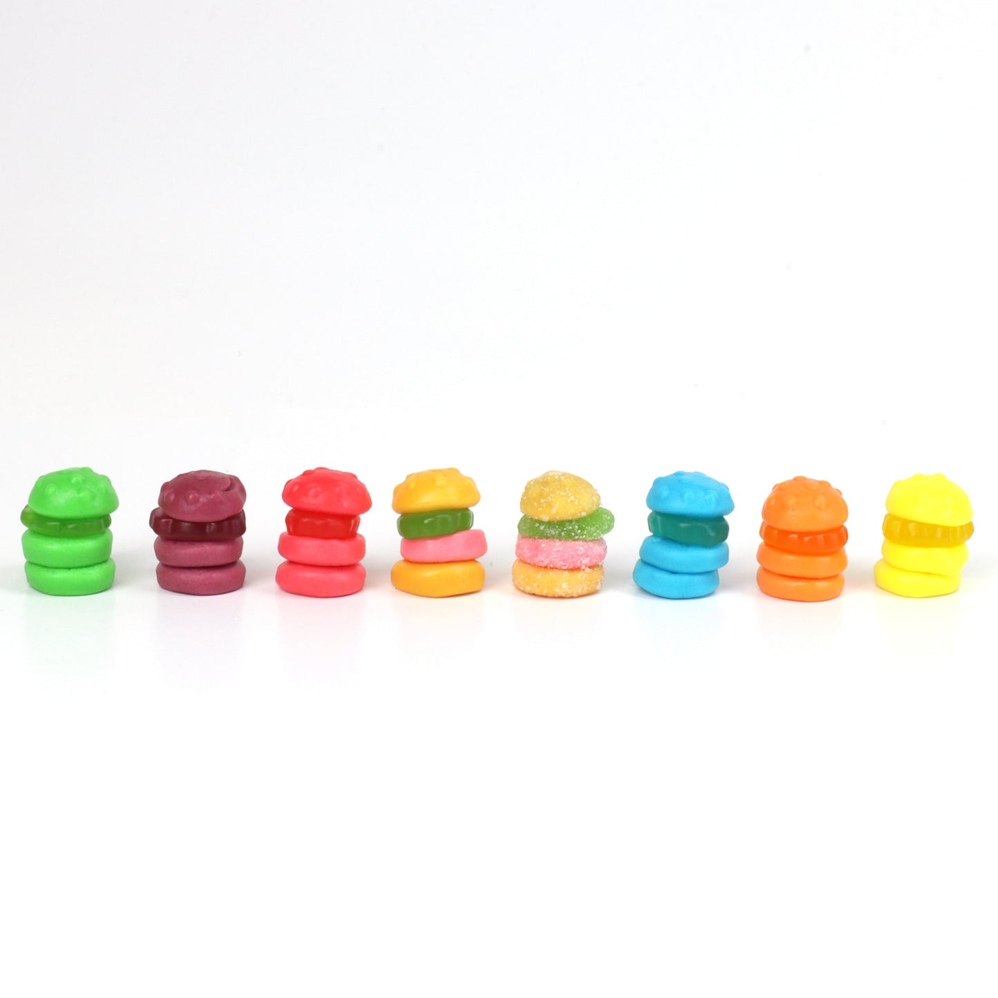 Row of colorful krabby patties on a white background