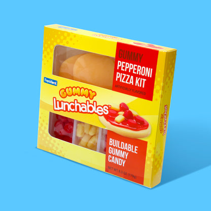 yellow box of gummy lunchables pepperoni pizza kit on light blue background
