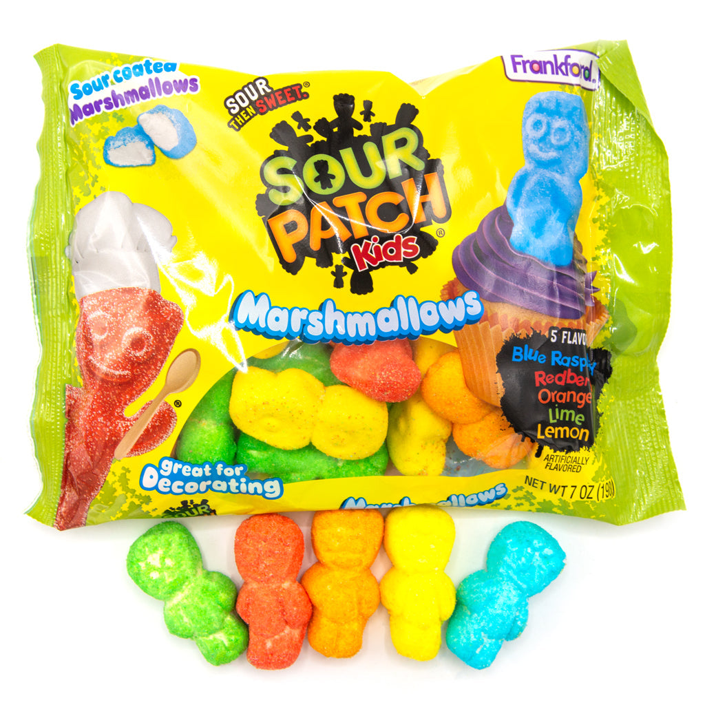 green and yellow bag with multi colored kid shaped marshmallows in the bag and laying flat in front