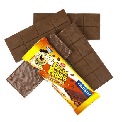 4 chocolate bars and 1 chocolate bar with yellow and orange wrapper on top