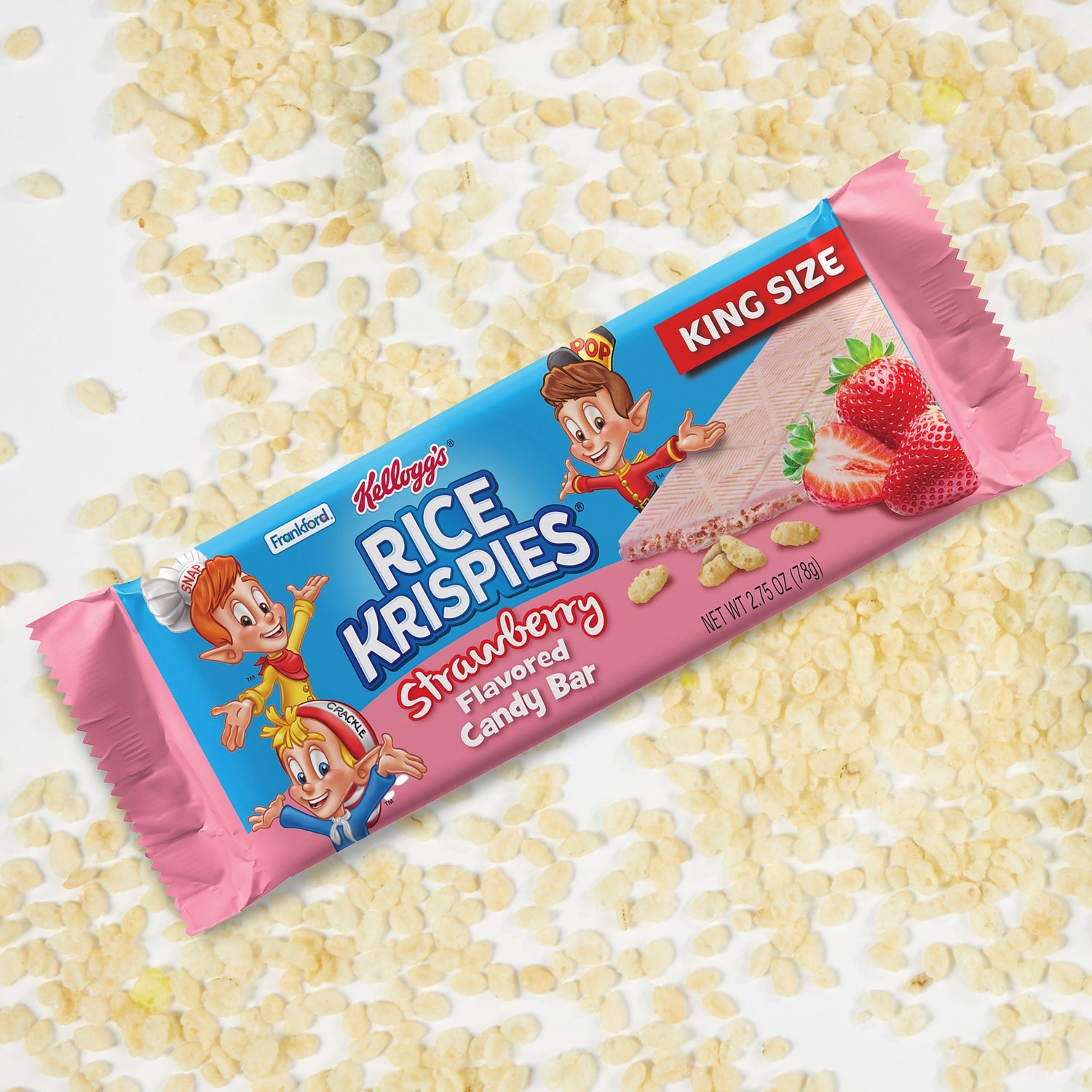Blue and pink candy bar wrapper surrounded by rice krispies cereal