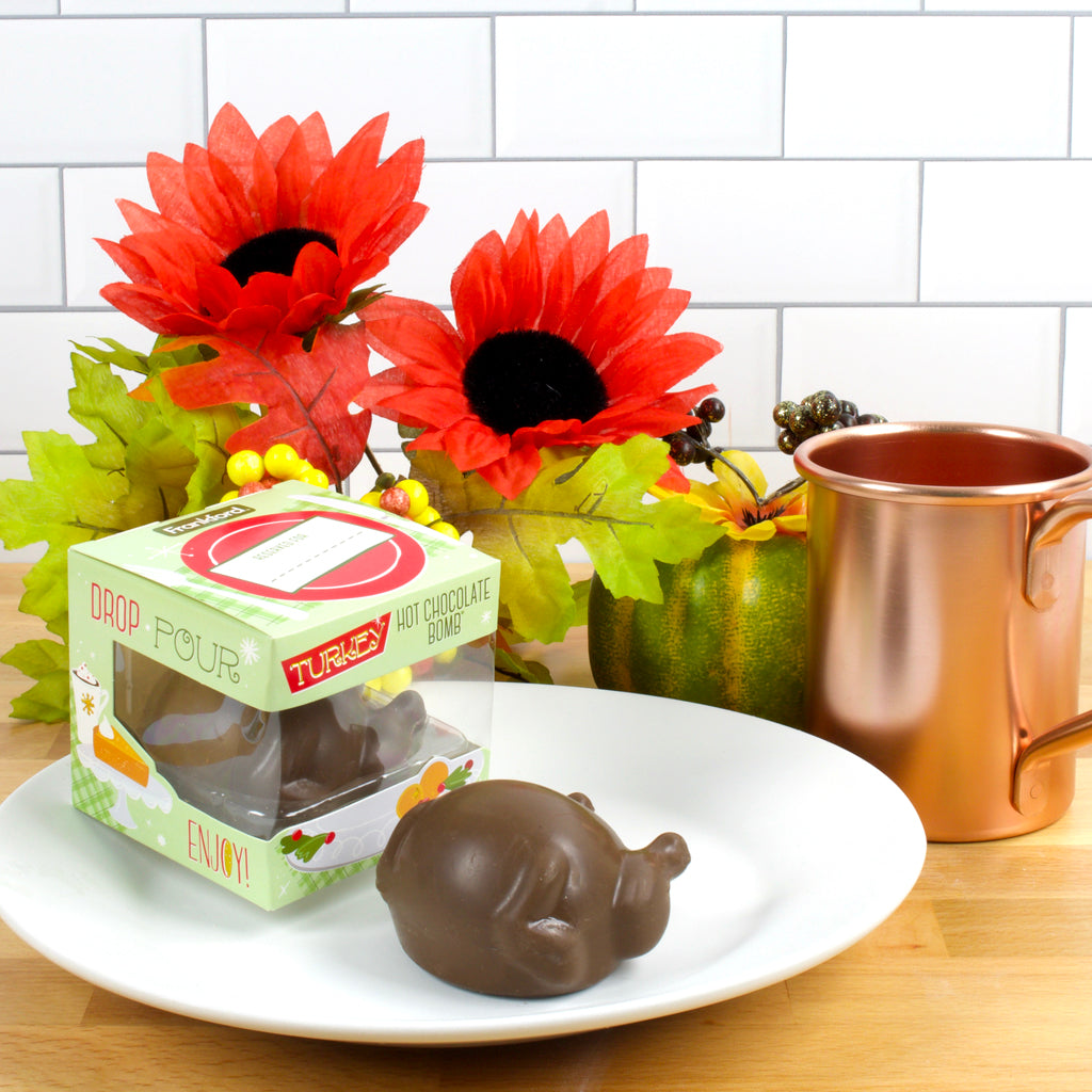 green hot chocolate bomb box on plate with turkey molded hot chocolate bomb
