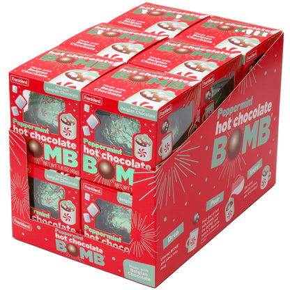 angle of red display case of 6 individual red boxes each with 1 green and snowflake print foil wrapped hot chocolate bomb