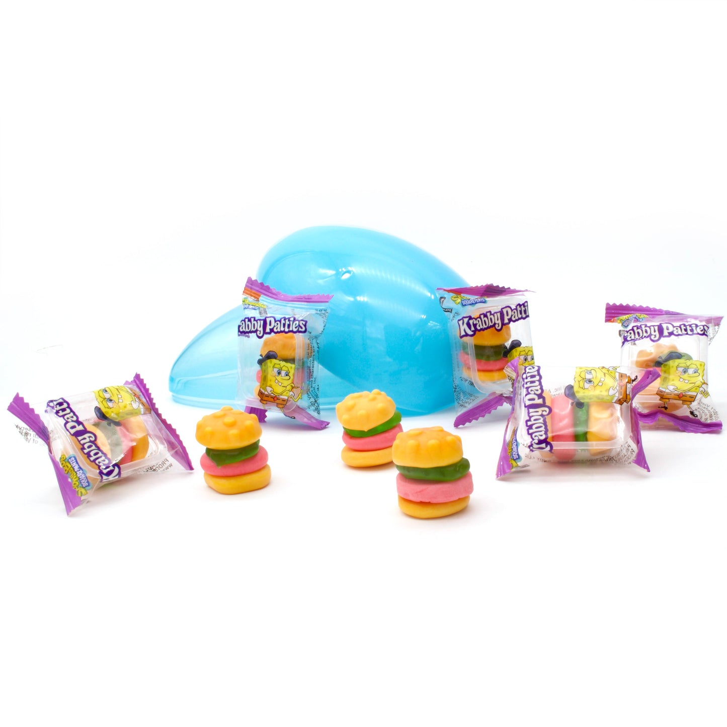 Opened blue plastic egg surrounded by individually wrapped and unwrapped krabby patties burgers gummies 
