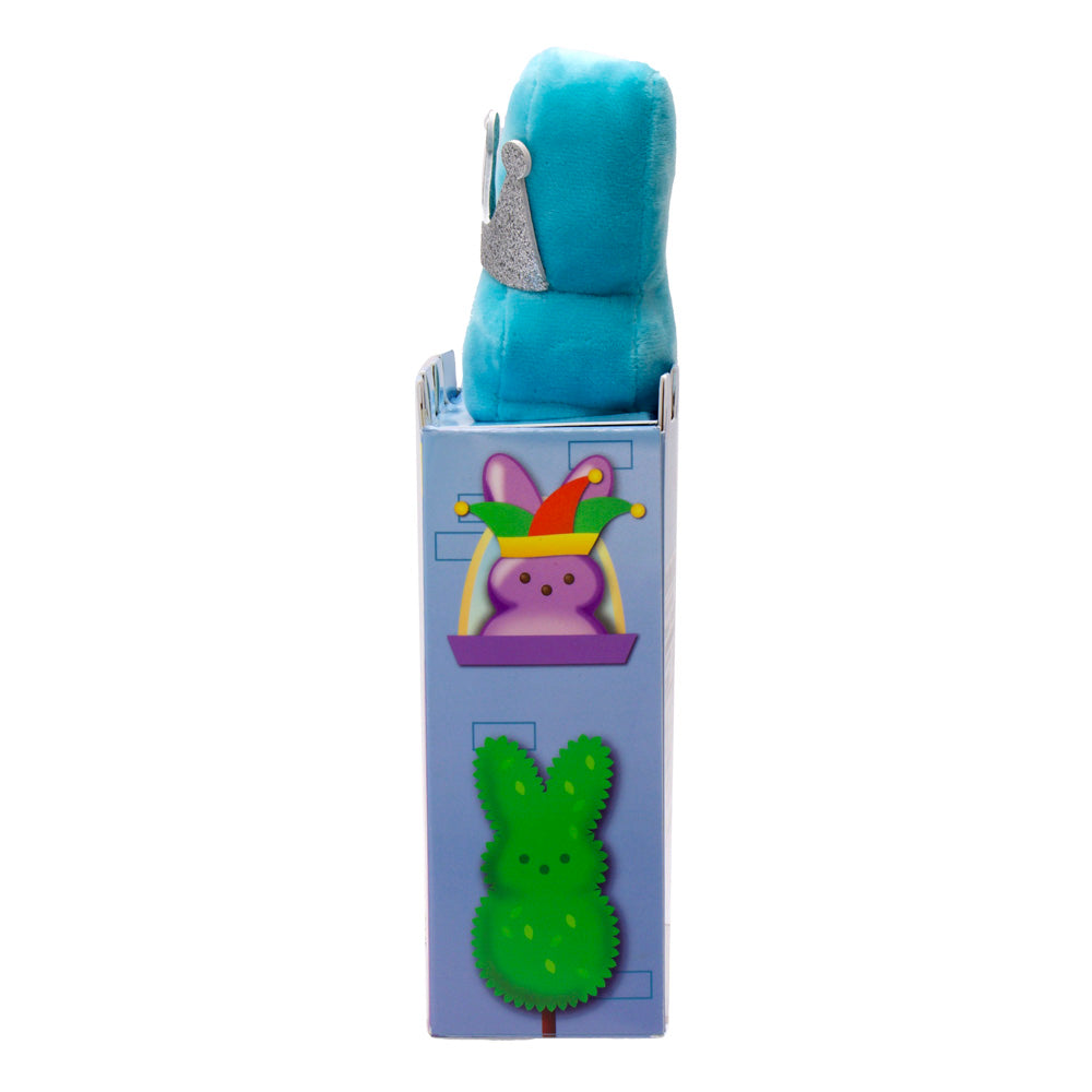 side of blue box with green bunny shaped bush and purple bunny wearing jester hat