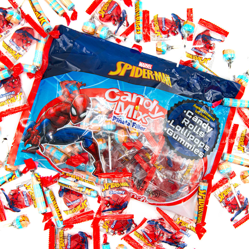 blue bag with spiderman decal and red individually wrapped candies on pile of red individually wrapped candies