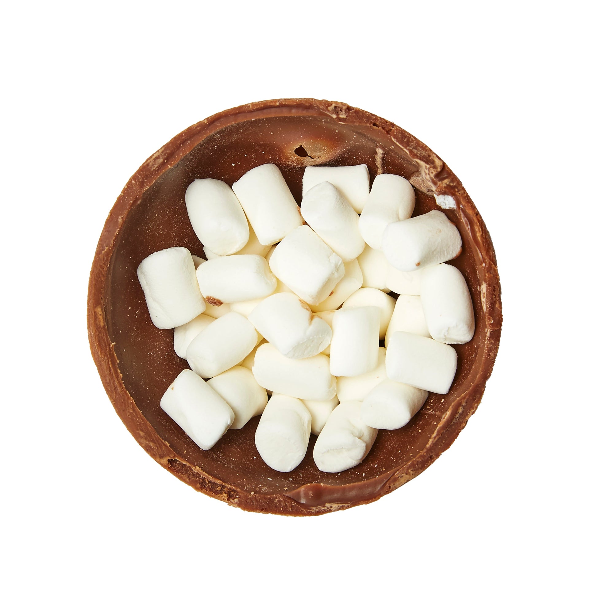 hot coca bomb broken up to show mini marshmallows inside