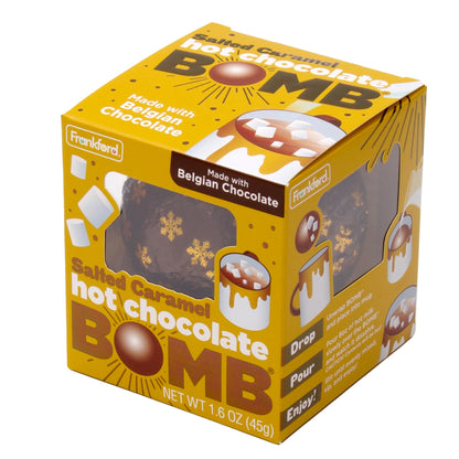 angle of yellow box with brown and snow flake print wrapped hot chocolate bomb
