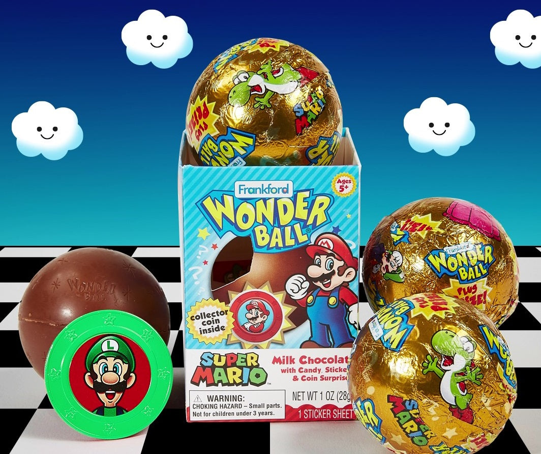 Opened blue wonderball box with 3 wonderballs wrapped in gold foil with Super Mario characters print and 1 unwrapped chocolate wonderball ball with green Luigi coin