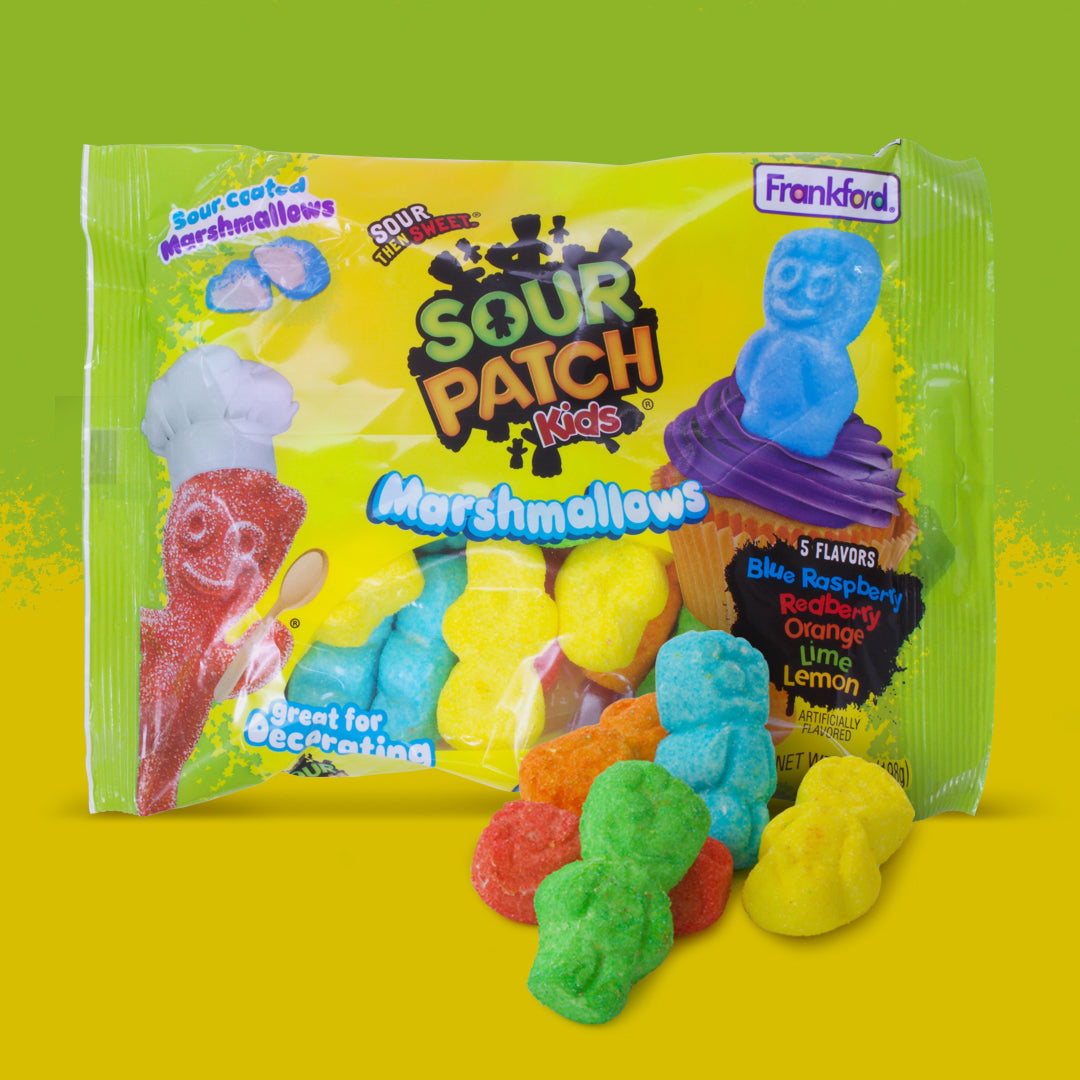 green and yellow bag with multi colored kid shaped marshmallows in the bag and in front 